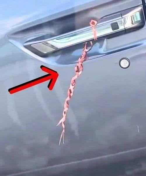 why finding string on car door handle is sign of danger